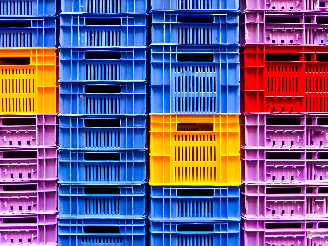 Empty plastic crates stacked up on each other