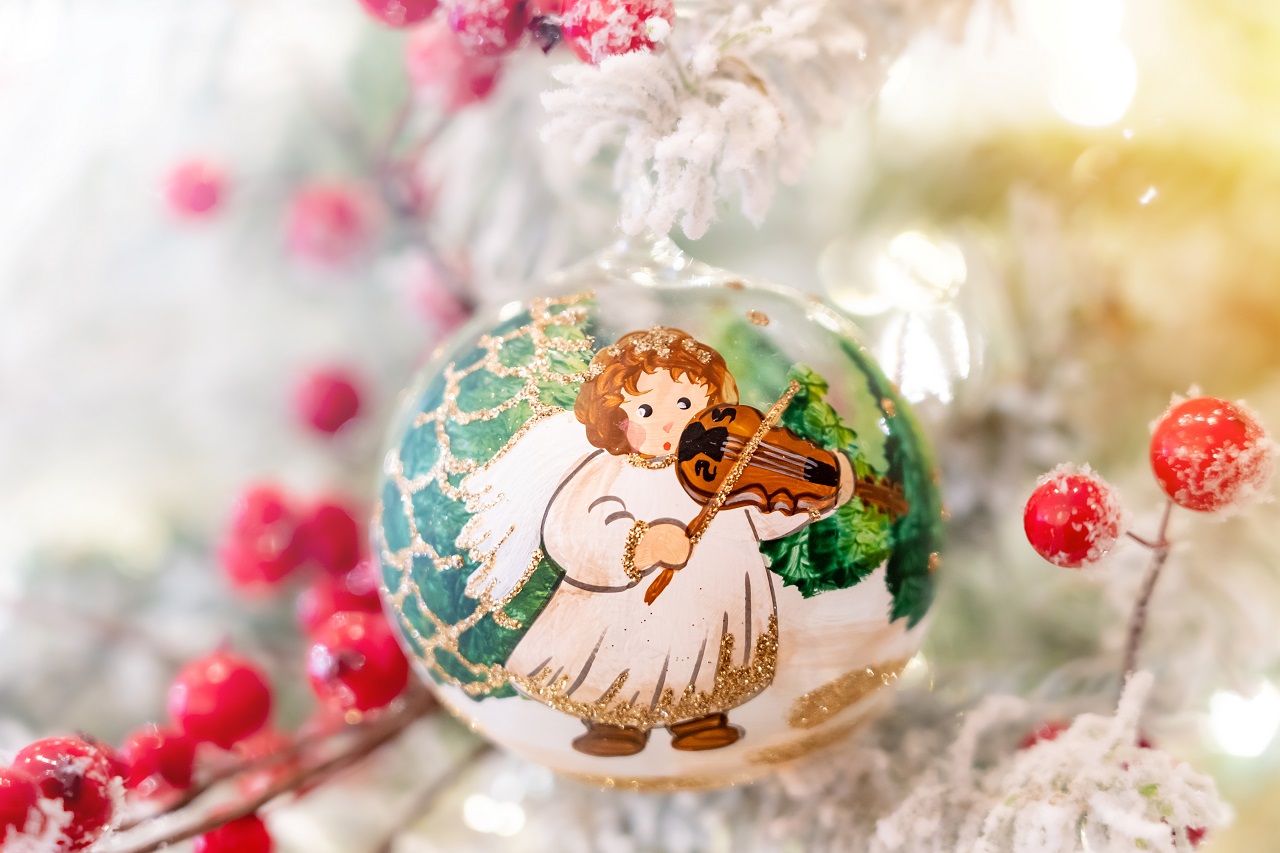 Close up of an angel painted on a Christmas ornament ball