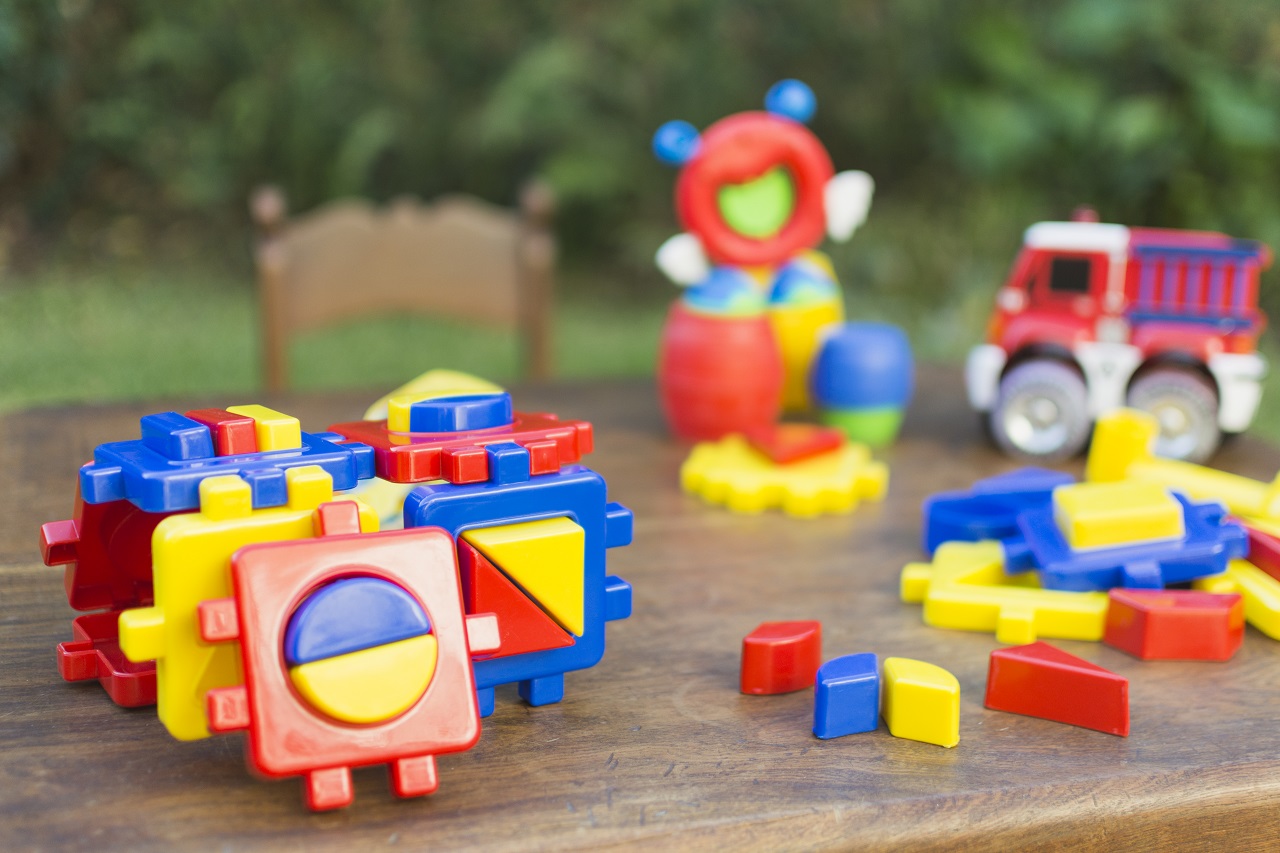 Plastic toys on a wooden table