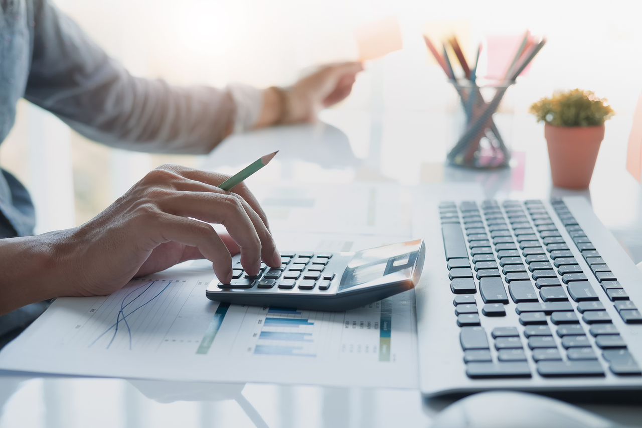 A businessman searching for the cost of injection molding vs. extrusion