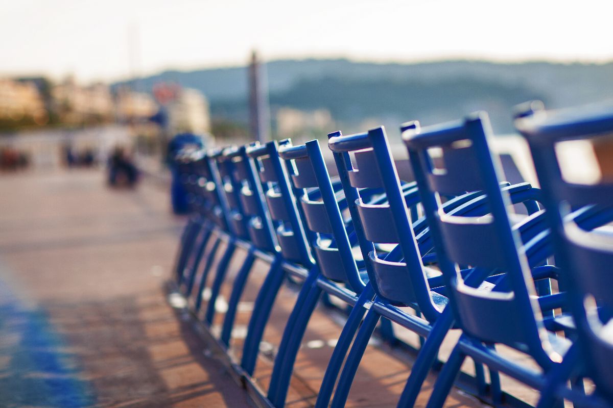 Injection-molded platic chairs being used outside at a park