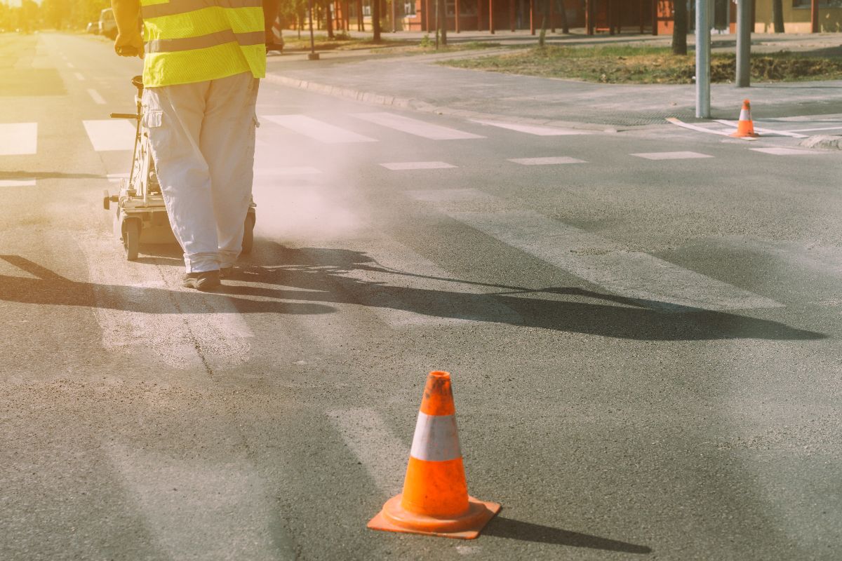 A traffic cone being used on the road for consturction 