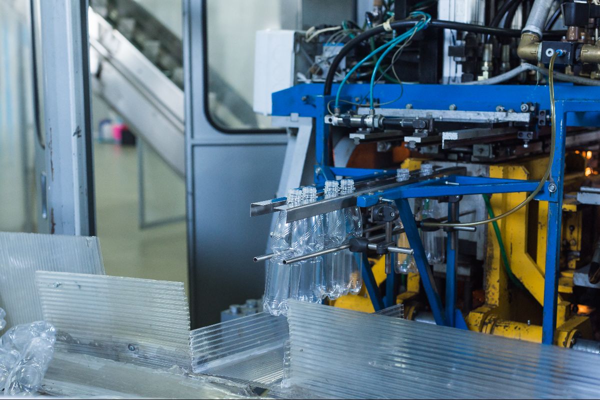 Plastic injected watter bottles coming out of production 